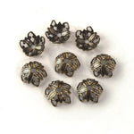 Stamped oxidized brass bead cap in a floral design. 9x4mm. Package of 12. b9-2376