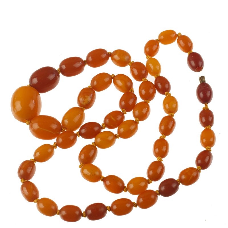 Baltic yellow Amber necklace. Oval butterscotch graduated beads. 22 in. 1910 1920's. j-nlbd2183