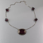 Art Deco pendant necklace, amethyst glass with floral bezel j-NLAD991