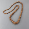 Vintage tea stained bone carved rose bead graduated necklace. 18.5 inches. j-nlbd2217